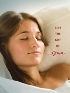 - Marion Salon Spa in Salt Point, NY A woman with her eyes closed rests peacefully beside the text "Give the Gift of Spa," promoting spa gift cards for services like deep tissue massage therapy. - Marion Salon Spa in Salt Point, NY